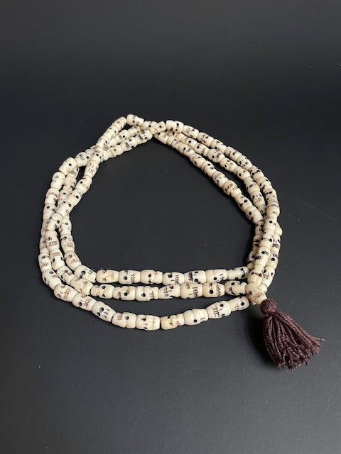 Very long yak bone necklace with skulls - white