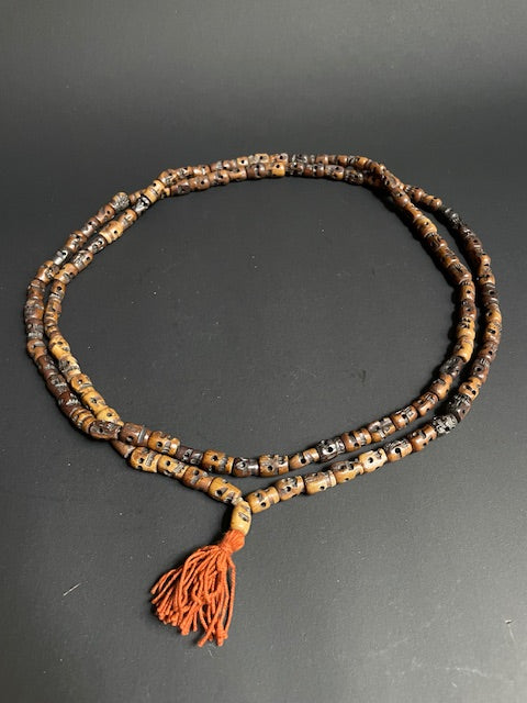 Long yak bone necklace with skulls - brown