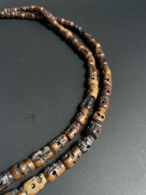 Long yak bone necklace with skulls - brown