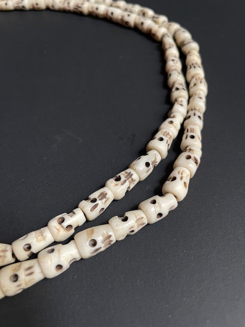 Long yak bone necklace with skulls - white